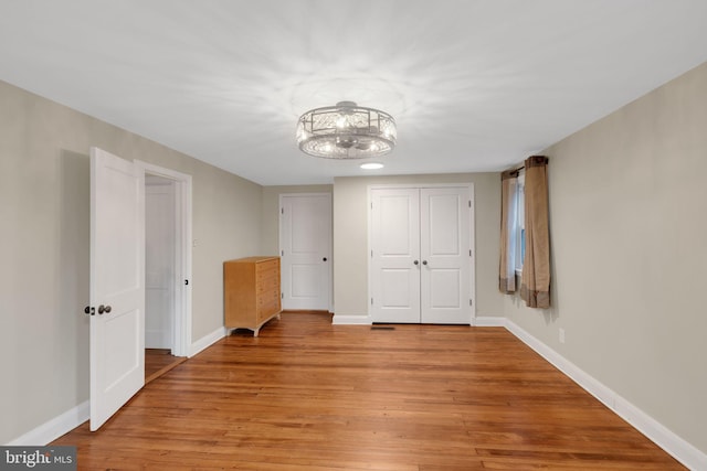 unfurnished bedroom with light hardwood / wood-style flooring