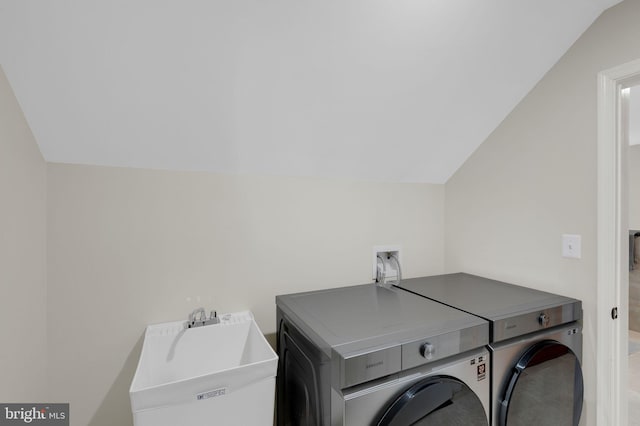 washroom featuring sink and washer and dryer