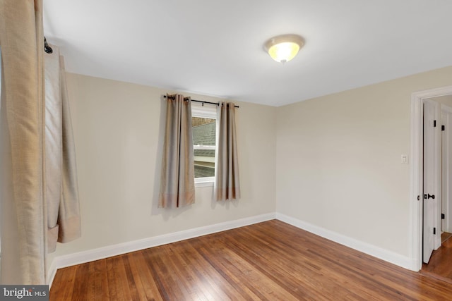 empty room featuring hardwood / wood-style flooring