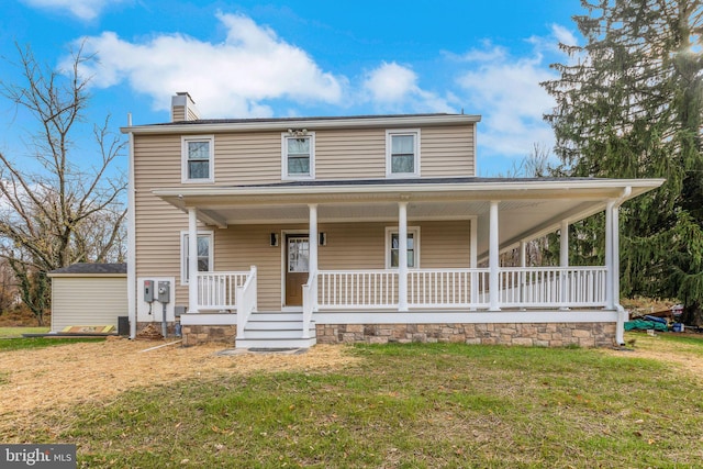 view of front facade featuring a porch and a front yard