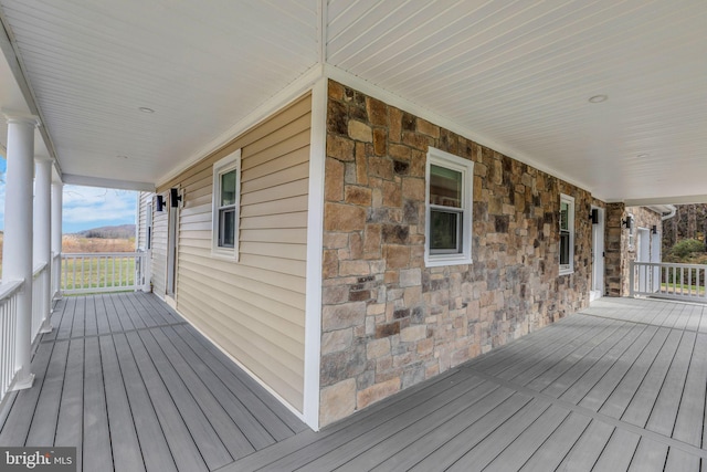 wooden terrace with a porch