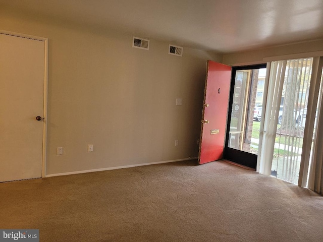 unfurnished room with carpet floors