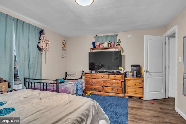 bedroom featuring dark hardwood / wood-style floors