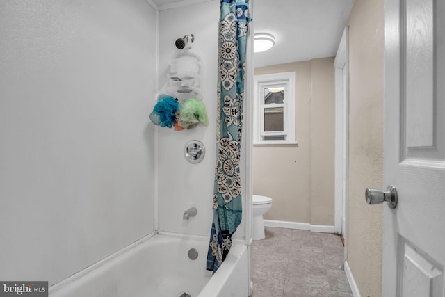 bathroom with toilet and shower / bath combo with shower curtain