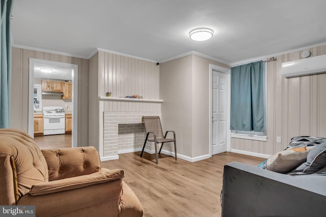 living room with a brick fireplace, ornamental molding, an AC wall unit, and light hardwood / wood-style flooring