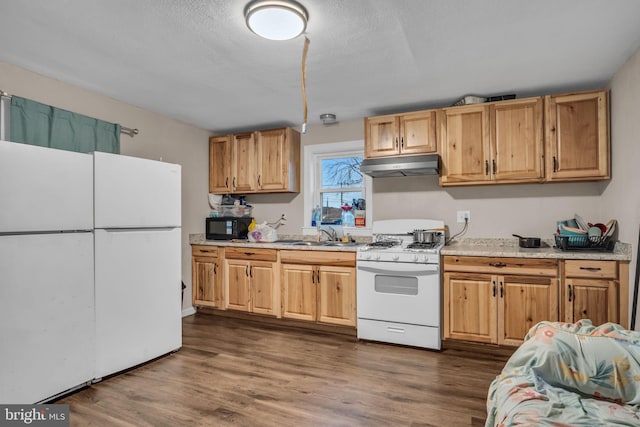 kitchen with a textured ceiling, dark hardwood / wood-style flooring, white appliances, and sink