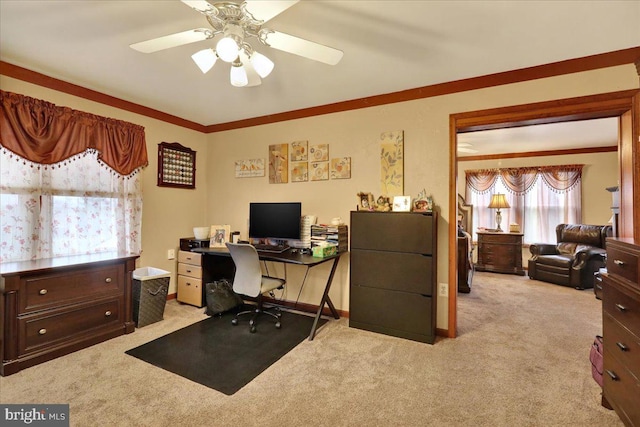 office space with light colored carpet, ceiling fan, and crown molding