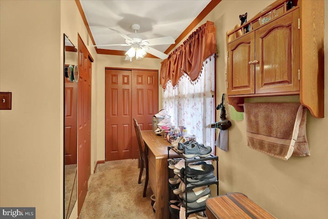 carpeted dining space with ceiling fan