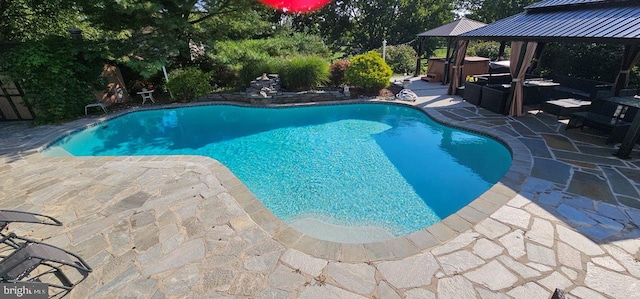 view of pool with a gazebo and a patio area