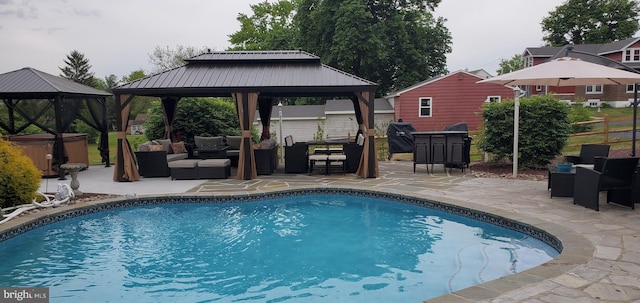 view of swimming pool featuring a gazebo, a patio, and an outdoor hangout area