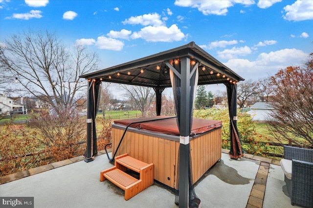 view of patio with a gazebo and a hot tub