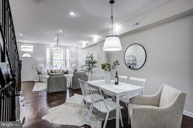 dining room with dark wood-type flooring