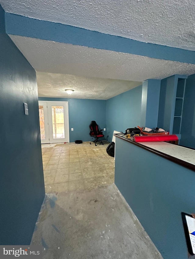 interior space featuring a textured ceiling