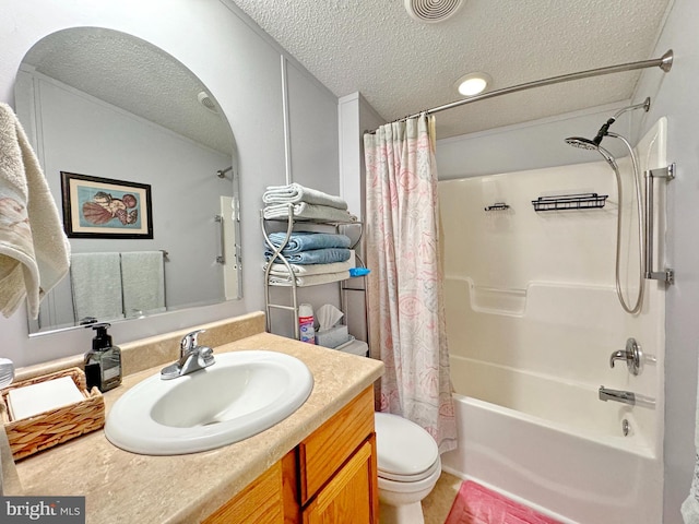 full bathroom with vanity, a textured ceiling, toilet, and shower / bath combo with shower curtain