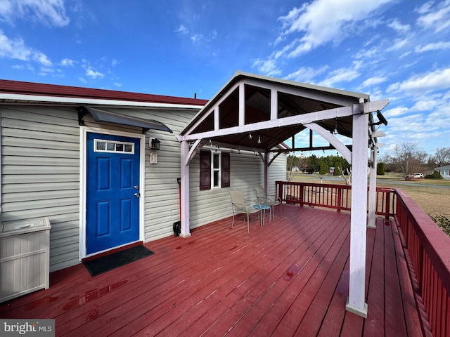 wooden deck featuring a gazebo