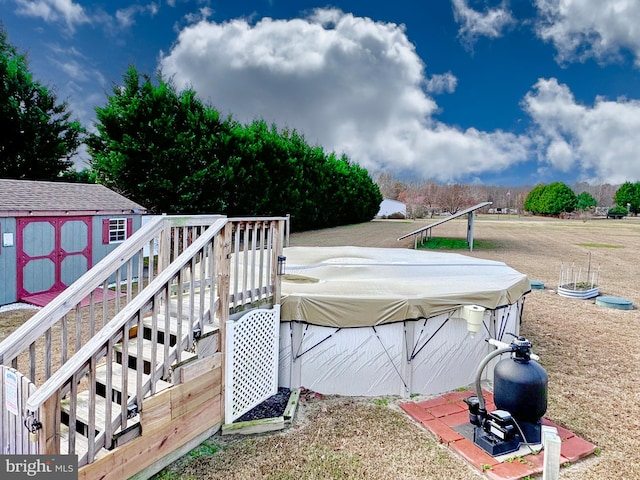 wooden deck with a storage unit and a pool