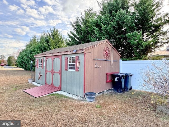 view of outbuilding featuring a yard