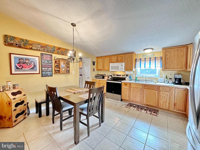 dining space featuring sink, an inviting chandelier, a textured ceiling, vaulted ceiling, and light tile patterned floors