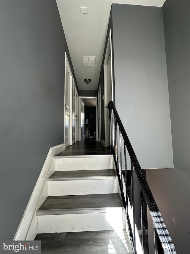 stairs with wood-type flooring