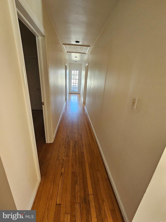 hallway featuring hardwood / wood-style floors