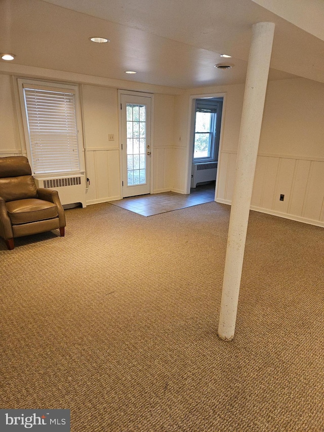 interior space featuring radiator and carpet