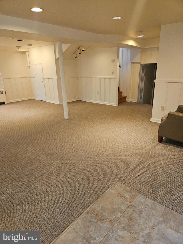 basement featuring carpet flooring