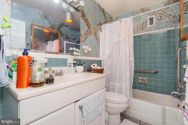 full bathroom featuring shower / bath combo, vanity, toilet, and tile walls