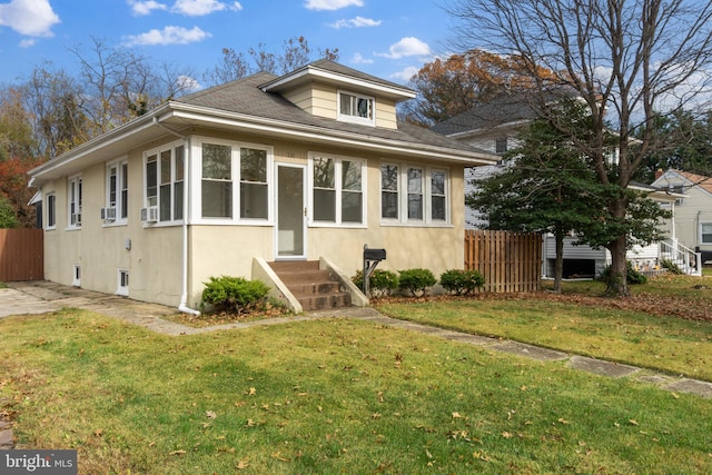 bungalow with a front lawn