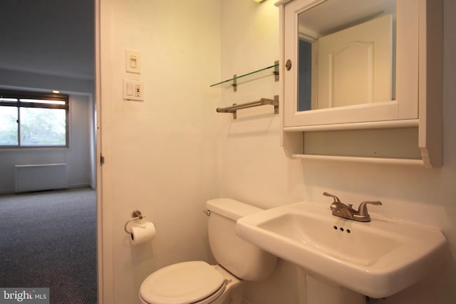 bathroom with toilet and sink