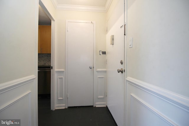 hall featuring a textured ceiling and crown molding