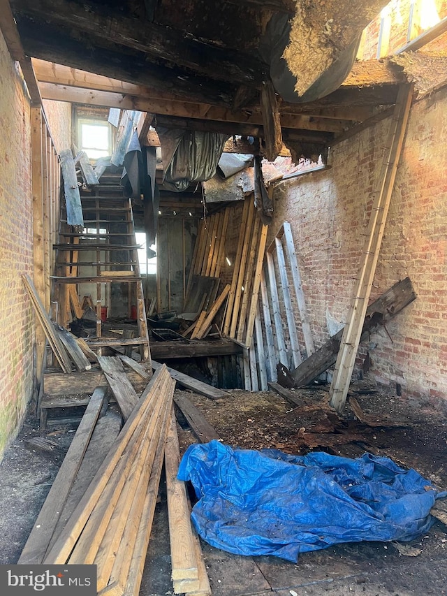 miscellaneous room featuring brick wall