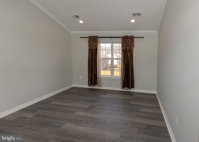 empty room with ornamental molding and dark hardwood / wood-style floors