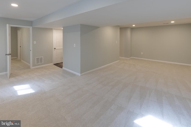 basement with light colored carpet