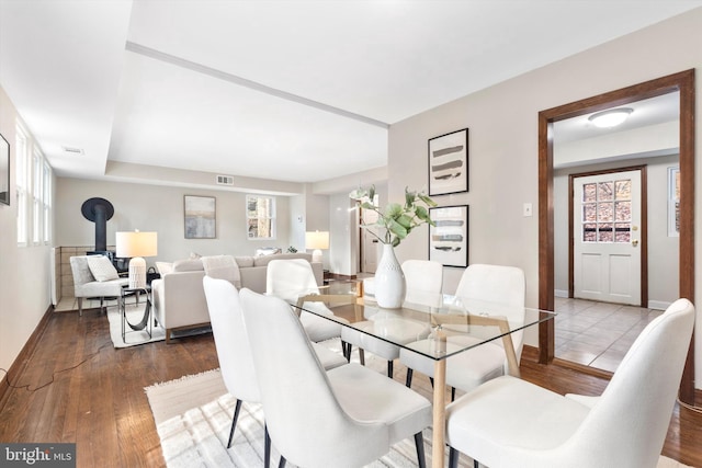 dining room with a chandelier, hardwood / wood-style floors, and a wealth of natural light