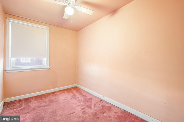 empty room with ceiling fan and carpet floors