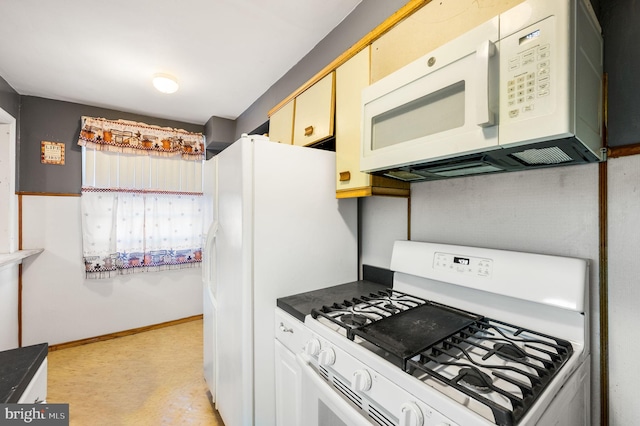 kitchen featuring light carpet and white appliances