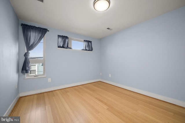 empty room with wood-type flooring