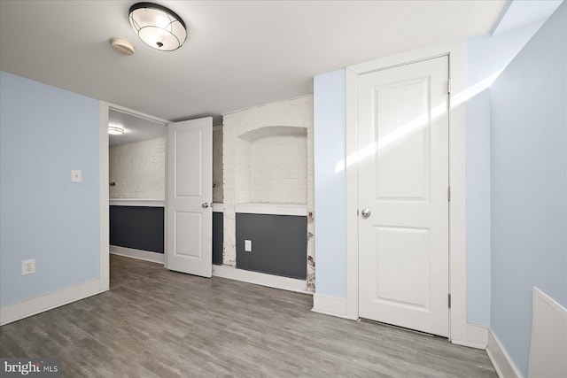 empty room featuring wood-type flooring