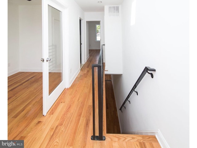 stairway with wood-type flooring