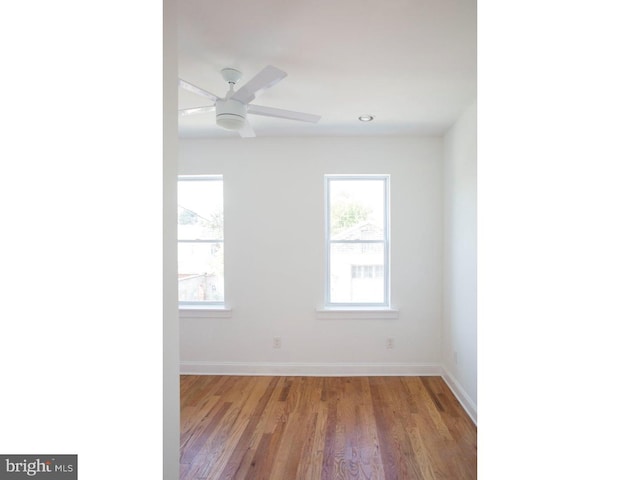 unfurnished room with ceiling fan and light hardwood / wood-style flooring