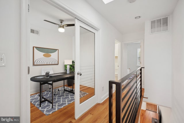 hallway with light wood-type flooring