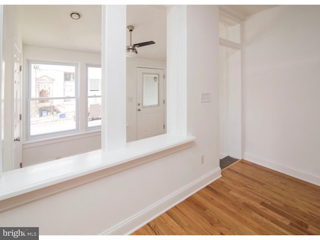 interior space with ceiling fan and hardwood / wood-style floors