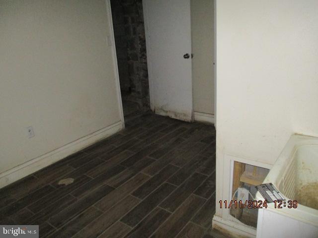 interior space with dark hardwood / wood-style flooring