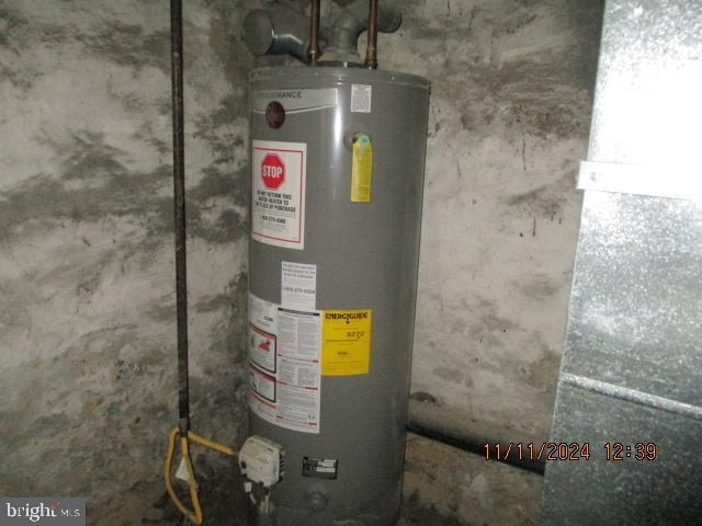 utility room with water heater