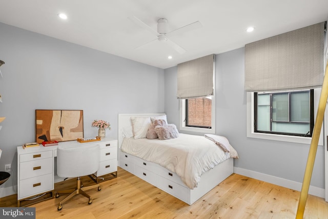 bedroom with recessed lighting, baseboards, and light wood finished floors