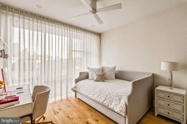 bedroom with light wood-type flooring and ceiling fan