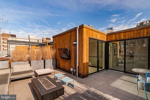 view of patio featuring an outdoor fire pit