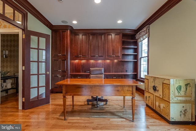 office featuring light hardwood / wood-style flooring and crown molding