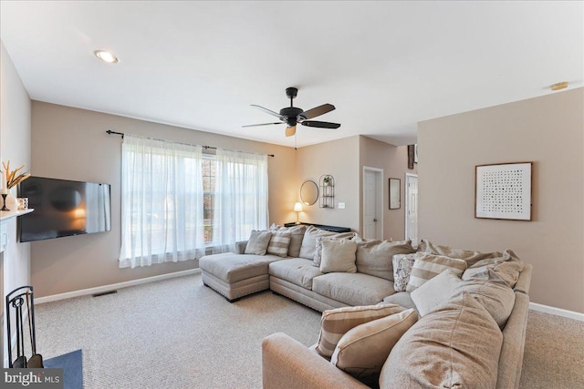 living room featuring carpet floors and ceiling fan