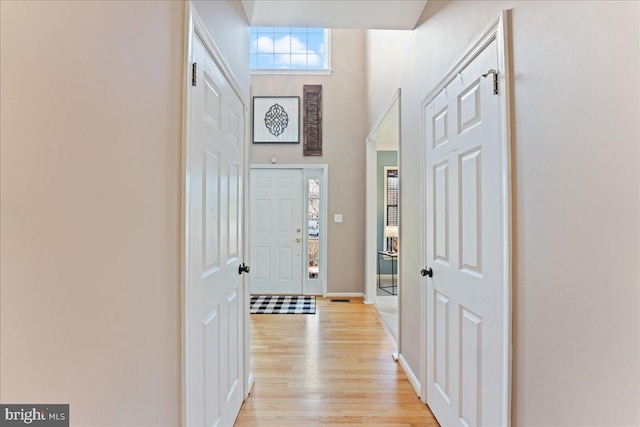 hall with light wood-type flooring